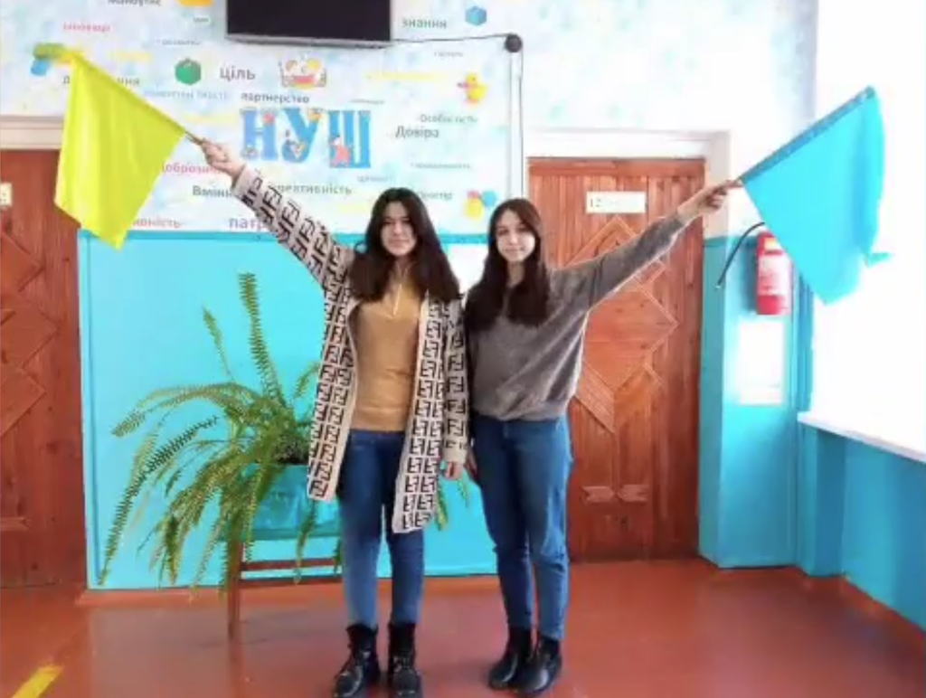 Young women in blue and yellow — the colors of the Ukrainian flag.