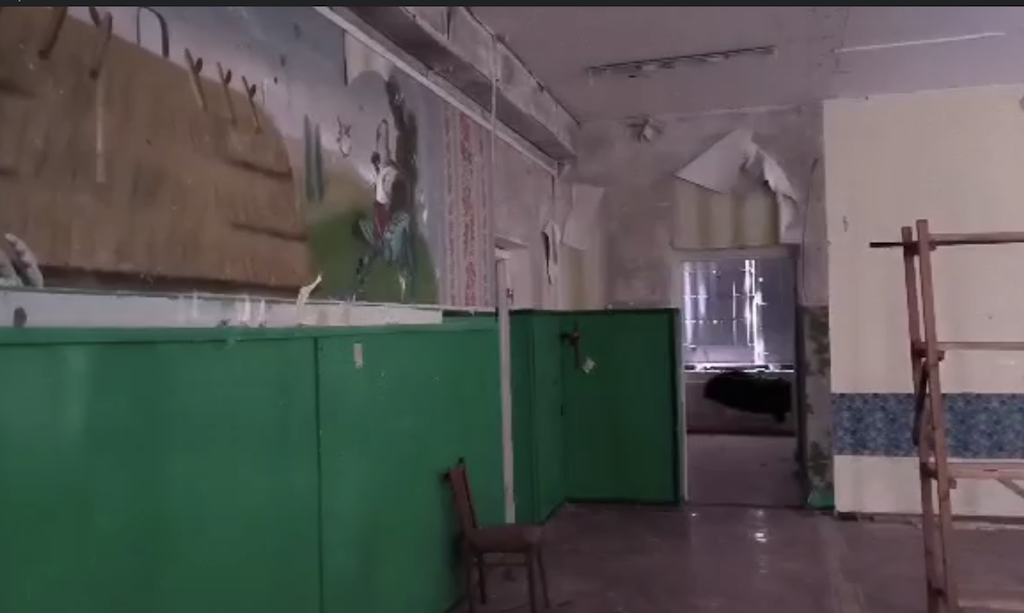 A damaged classroom interior no longer safe to occupy.